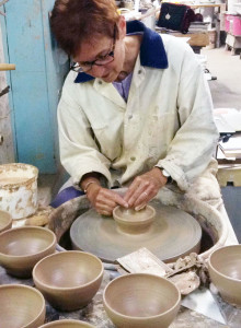 Mary Hepburn creates bowls with her students for the local Empty Bowl Dinner. Her work is featured at the RAC this month.