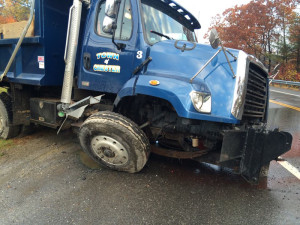 Dump truck passenger side damage.