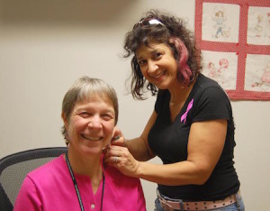 Sandy Peplau receives the "Pink" hair treatment from Lori Brown of Boccaccio's Hair Salon.