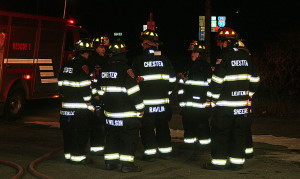 Chester firefighters standing by in new turnout gear given to the department by Raymond Dalio.