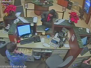 Suspect at window with teller drawer open
