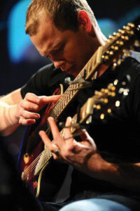 Ian Ethan Case performas on his 18-string double-neck acoustic guitar in Stone Church Arts program