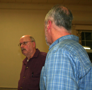 Tom Hildreth (left) and Frank Kelly give the board a progress report on a celebration marking the town's 1766 charter.