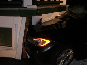 Both the gazebo and the car were damaged. The driver was not injured.