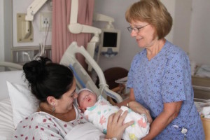 Paula Faucher, RN, assists mother and baby at Springfield Hospital's Child Birth Center.