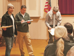 From left, artist Michael Alon addresses the group, led by Jason Rasmussen and Bob Flint. Photos by Shawn Cunningham.