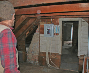 Eric Kruger in the attic of the Burbank house. All photos by Shawn Cunningham