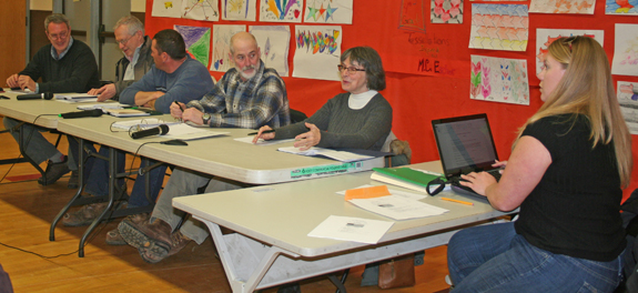 In the 2nd meeting of the new Grafton Select Board since last Tuesday's election, from left, sit board members Skip Lisle, Ron Pilette, chair Gus Plummer, vice chair Al Sands, Cynthia Gibbs and outgoing Town Administrator Rachel Williams. Photos by Cynthia Prairie