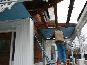 The blue porch ceiling and lattice work come down.