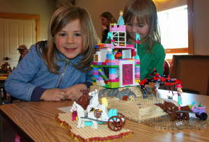6-year-old Victoria smiles as she shows off her Pretty Princess Palace.