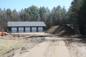 The Londonderry town garage with 2300 yards of recently moved sand in the foreground to the right