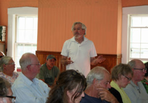 Jack Bryar, standing, offers to become interim Select Board member until the election.