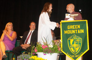 Rylee Ewald receives the English Department Pin from teacher Norm Merrill