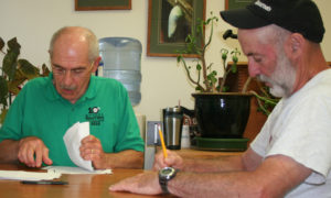 David Ross, left, and Select Board chair Al Sands count ballots. Photo by Cynthia Prairie