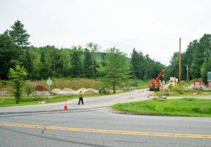 Green Mountain Power crews work at Sylvan Road and Route 103 replacing three poles that were snapped off when wires were hit by an oversized load. Photos by Shawn Cunningham