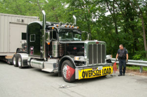 DMV Inspector Jeff White checks out one of the trucks involved on Friday morning
