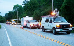 Contractors beginning a night of work restoring fiber-optic cables along Route 103 North.