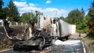 The cab of a truck carrying silica gel burst into flames Friday afternoon. No one was injured. Photos by Shawn Cunningham