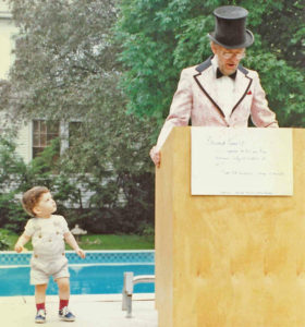 Coleman giving an Independence Day oration as grandson Wil looks on in 1986