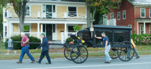 Chester Public Works crew moves the hearse past the Henry Building.