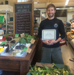 General manager James Kerrigan receives the community champion award at Jake’s Quechee Market & Café. 