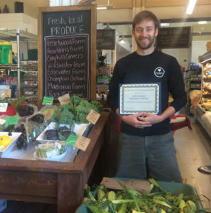 General manager James Kerrigan receives the community champion award at Jake’s Quechee Market & Café.