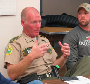 VSP Lt. Tim Oliver explaining the purpose of traffic stops while Policing Committee member Mike Arace listens.