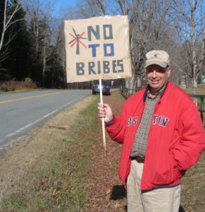 Windham resident Christopher Keating expresses his opinion on the wind issue outside the Windham town office. Photos by John Hoover>