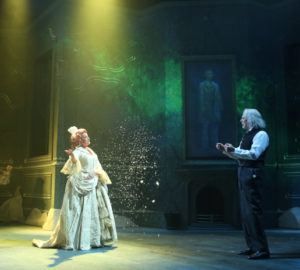 Susan Haefner, as the Ghost of Christmas Past, left, and Bill Kux as Scrooge.