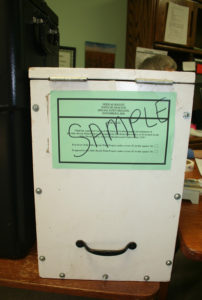 Ballot box with sample article in Grafton. Photo by Shawn Cunningham.