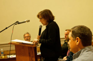 Marilyn Mahusky reads a letter to the board from Phil Perlah who was unable to attend