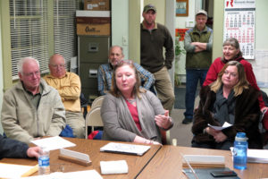Maryann Morris, center, delivers the Policing Committee's recommendation to renew the VSP contract. Photos by Bruce Frauman