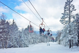 Skiers and snowboarders ride the Red Chairlift to the summit last Friday. Photo provided
