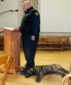 Police chief Rick Cloud reports on his department in 2017, while Dutch relaxes