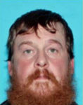Wanted man killed in hostage standoff
