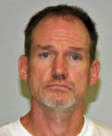 Police search for escaped murderer