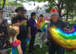The parade attracted more than 20 supporters including a becrowned Carrie King, children's librarian at the Whiting Library.