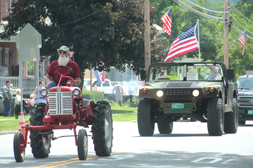 Antique tractor and a Hummer. 