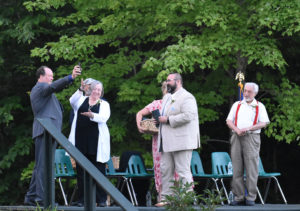 Orion Corwin receives his diploma by video on Mike Ripley's phone. According to the school, Corwin could not attend as he had tested positive for Covid.