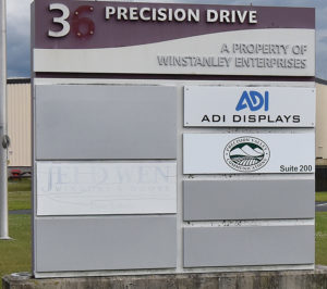 A dilapidated sign announces the presence of the Jeld Wen plant in North Springfield